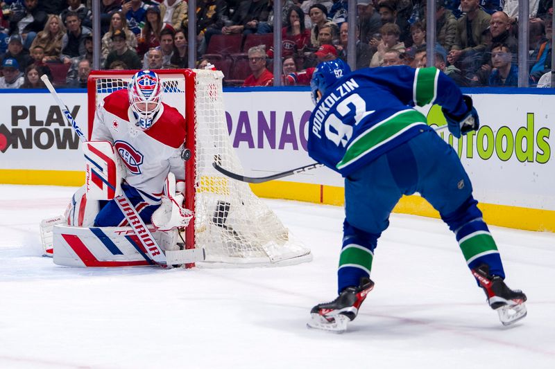 Mar 21, 2024; Vancouver, British Columbia, CAN; Montreal Canadiens goalie Sam Montembeault (35) makes a save on Vancouver Canucks forward Vasily Podkolzin (92) in the first period at Rogers Arena. Mandatory Credit: Bob Frid-USA TODAY Sports