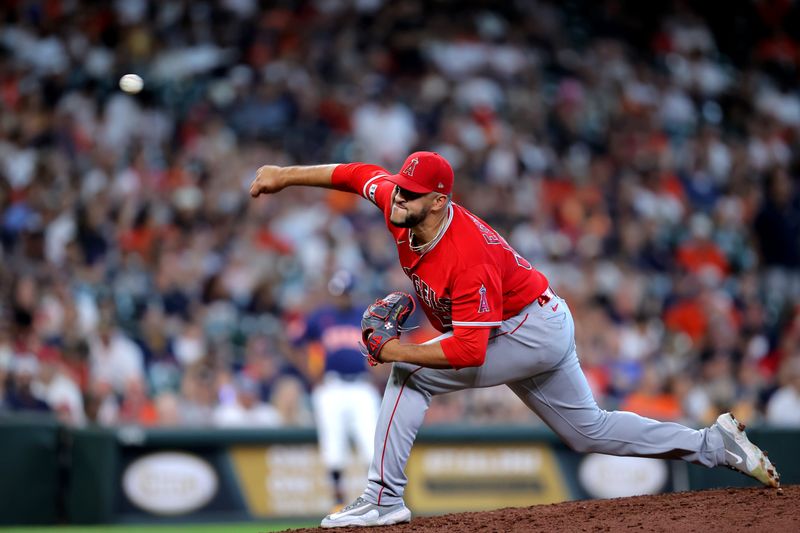 Aug 13, 2023; Houston, Texas, USA; Los Angeles Angels relief pitcher Carlos Estevez (53) delivers a pitch against the Houston Astros during the ninth inning at Minute Maid Park. Mandatory Credit: Erik Williams-USA TODAY Sports