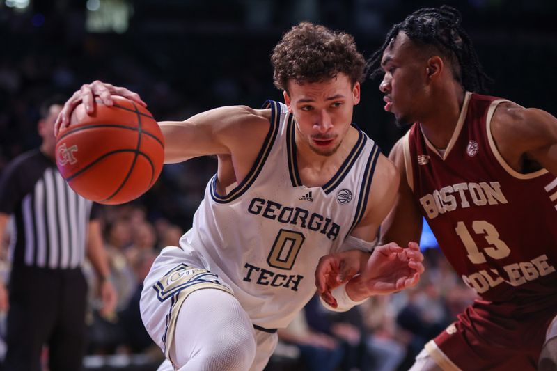 Jan 4, 2025; Atlanta, Georgia, USA; Georgia Tech Yellow Jackets guard Lance Terry (0) drives on Boston College Eagles guard Donald Hand Jr. (13) in the second half at McCamish Pavilion. Mandatory Credit: Brett Davis-Imagn Images
