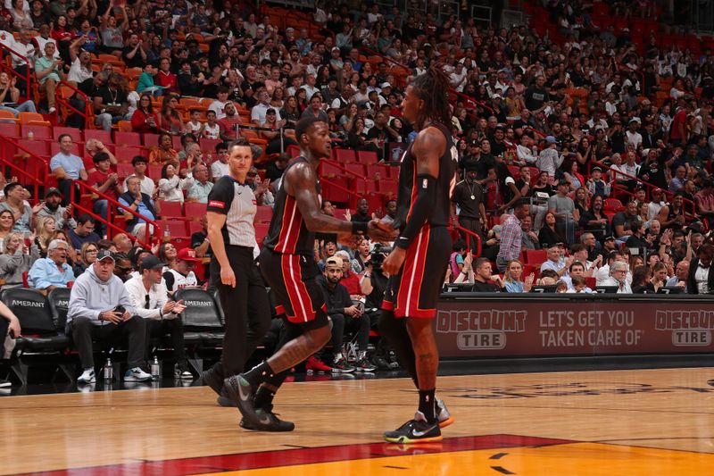 MIAMI, FL - MARCH 24: Terry Rozier #2 of the Miami Heat high fives Delon Wright #4 during the game against the Cleveland Cavaliers on March 24, 2024 at Kaseya Center in Miami, Florida. NOTE TO USER: User expressly acknowledges and agrees that, by downloading and or using this Photograph, user is consenting to the terms and conditions of the Getty Images License Agreement. Mandatory Copyright Notice: Copyright 2024 NBAE (Photo by Issac Baldizon/NBAE via Getty Images)