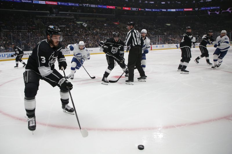 Mar 23, 2024; Los Angeles, California, USA; Los Angeles Kings defensemen Matt Roy (3) moves the puck during the first period of an NHL hockey game against the Tampa Bay Lighting at Crypto.com Arena. Mandatory Credit: Yannick Peterhans-USA TODAY Sports