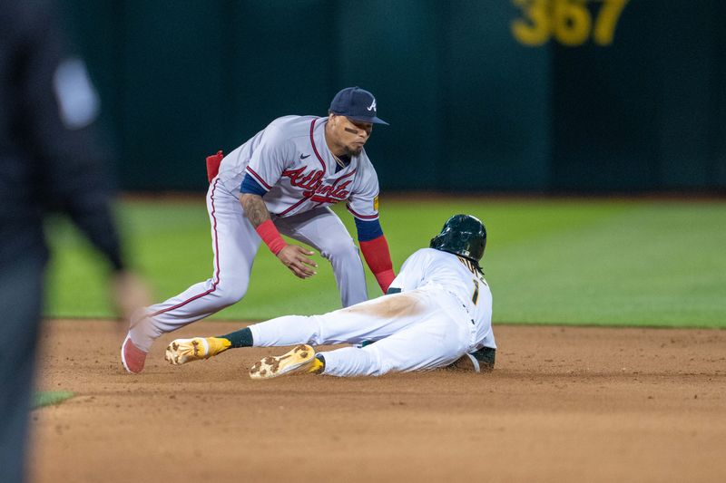 May 30, 2023; Oakland, California, USA;  Oakland Athletics center fielder Esteury Ruiz (1) is tagged out stealing second base by Atlanta Braves shortstop Orlando Arcia (11) during the eighth inning at Oakland-Alameda County Coliseum. Mandatory Credit: Neville E. Guard-USA TODAY Sports