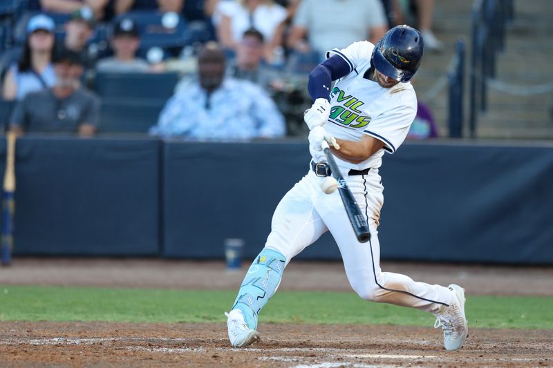 Apr 19, 2025; Tampa, Florida, USA; Tampa Bay Rays second baseman Brandon Lowe (8) hits a two rbi single against the New York Yankees in the ninth inning at George M. Steinbrenner Field. Mandatory Credit: Nathan Ray Seebeck-Imagn Images