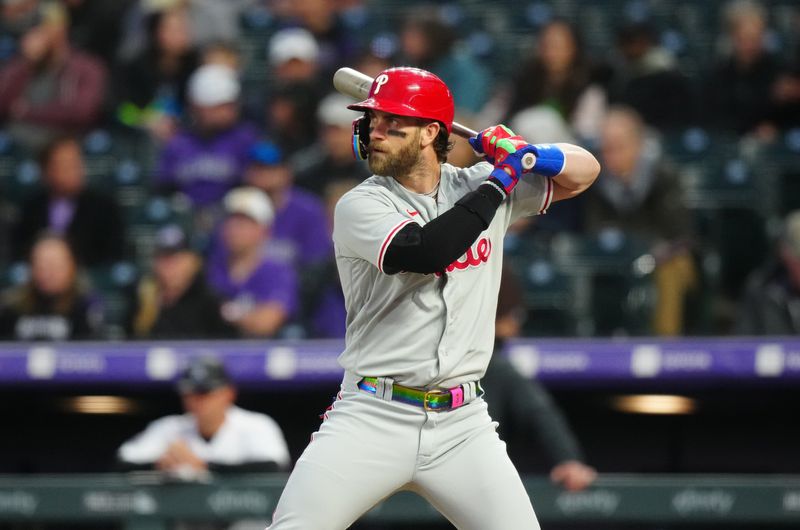 May 12, 2023; Denver, Colorado, USA;  Philadelphia Phillies designated hitter Bryce Harper (3) on deck in the seventh inning against the Colorado Rockies at Coors Field. Mandatory Credit: Ron Chenoy-USA TODAY Sports