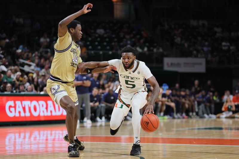 Feb 24, 2024; Coral Gables, Florida, USA; Miami Hurricanes guard Wooga Poplar (5) dribbles the basketball as Georgia Tech Yellow Jackets guard Kowacie Reeves Jr. (14) defends during the second half at Watsco Center. Mandatory Credit: Sam Navarro-USA TODAY Sports