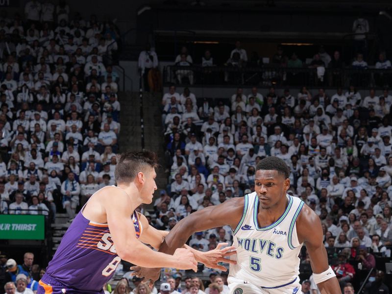 MINNEAPOLIS, MN -  APRIL 20: Anthony Edwards #5 of the Minnesota Timberwolves dribbles the ball during Round One Game One of the 2024 NBA Playoffs against the Phoenix Suns on April 20, 2024 at Target Center in Minneapolis, Minnesota. NOTE TO USER: User expressly acknowledges and agrees that, by downloading and or using this Photograph, user is consenting to the terms and conditions of the Getty Images License Agreement. Mandatory Copyright Notice: Copyright 2024 NBAE (Photo by Jordan Johnson/NBAE via Getty Images)