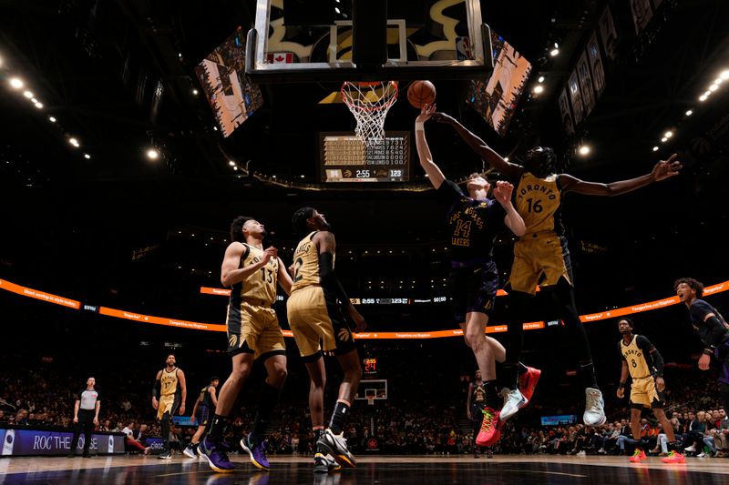 TORONTO, CANADA - APRIL 2: Colin Castleton #14 of the Los Angeles Lakers drives to the basket during the game against the Toronto Raptors on April 2, 2024 at the Scotiabank Arena in Toronto, Ontario, Canada.  NOTE TO USER: User expressly acknowledges and agrees that, by downloading and or using this Photograph, user is consenting to the terms and conditions of the Getty Images License Agreement.  Mandatory Copyright Notice: Copyright 2024 NBAE (Photo by Mark Blinch/NBAE via Getty Images)