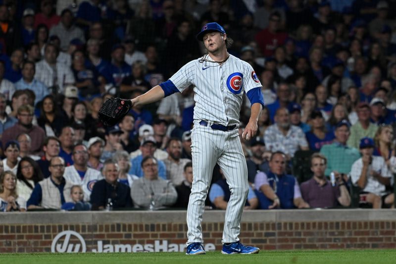 Sep 20, 2023; Chicago, Illinois, USA; Chicago Cubs starting pitcher Justin Steele (35) reacts after not being able to throw Pittsburgh Pirates right fielder Connor Joe (2) out at first base during the fourth inning it Wrigley Field. Mandatory Credit: Matt Marton-USA TODAY Sports