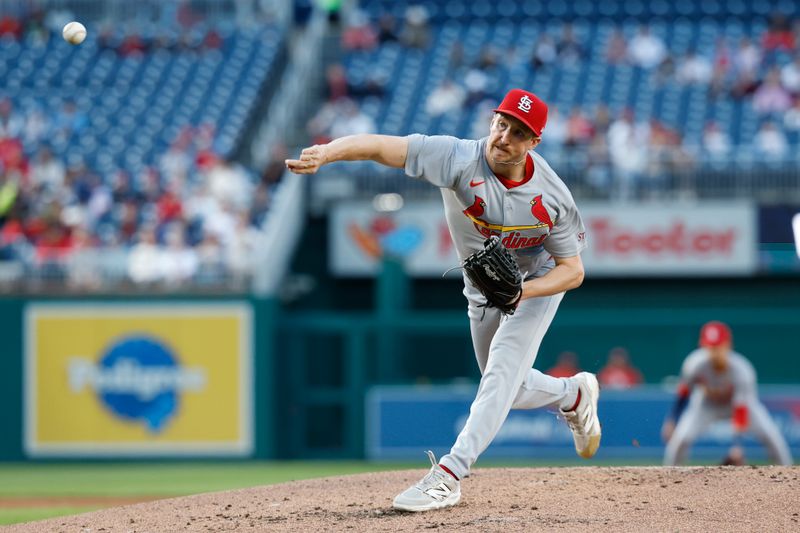 May 9, 2025; Washington, District of Columbia, USA; St. Louis Cardinals starting pitcher Erick Fedde (12) pitches against the Washington Nationals during the second inning at Nationals Park. Mandatory Credit: Geoff Burke-Imagn Images