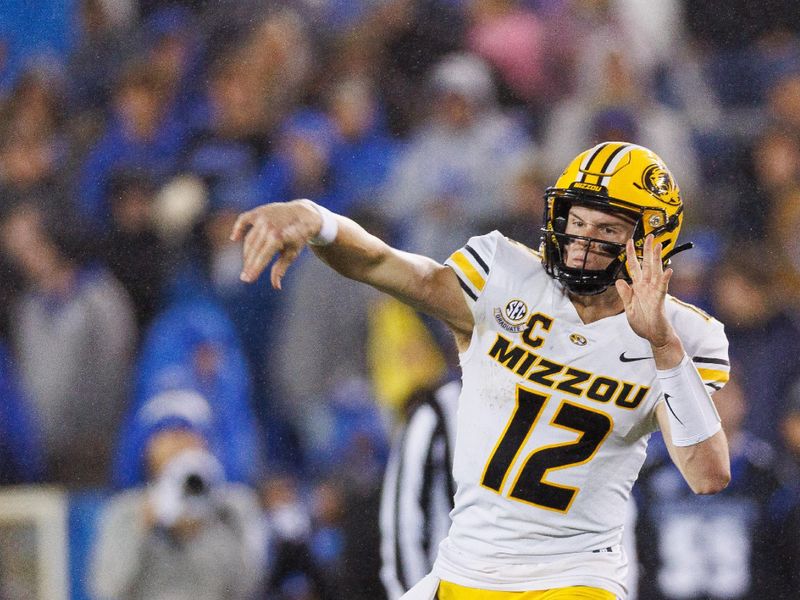 Oct 14, 2023; Lexington, Kentucky, USA; Missouri Tigers quarterback Brady Cook (12) throws a pass during the third quarter against the Kentucky Wildcats at Kroger Field. Mandatory Credit: Jordan Prather-USA TODAY Sports