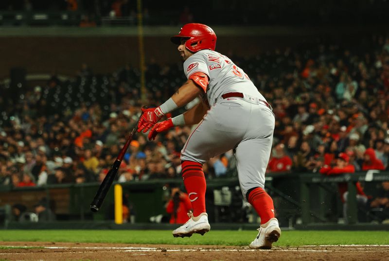 Aug 28, 2023; San Francisco, California, USA; Cincinnati Reds first baseman Christian Encarnacion-Strand (33) releases the bat as he hits a double against the San Francisco Giants during the seventh inning at Oracle Park. Mandatory Credit: Kelley L Cox-USA TODAY Sports