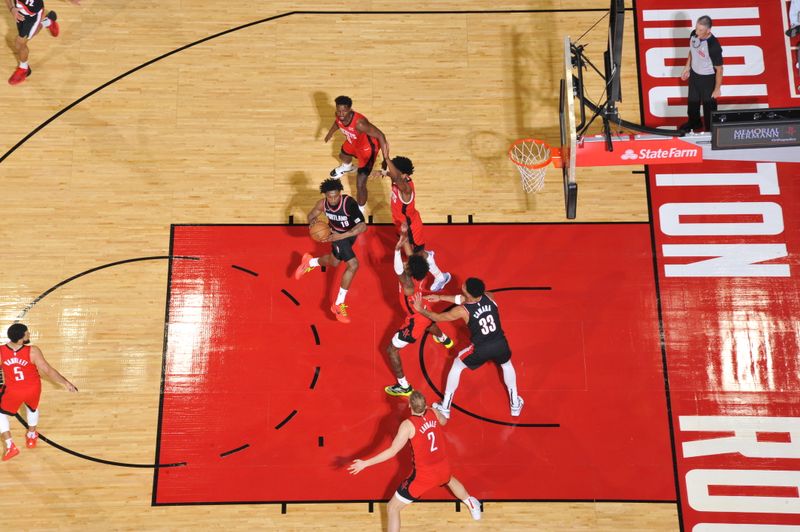 HOUSTON, TX - MARCH 25: Ashton Hagans #19 of the Portland Trail Blazers drives to the basket during the game against the Houston Rockets on March 25, 2024 at the Toyota Center in Houston, Texas. NOTE TO USER: User expressly acknowledges and agrees that, by downloading and or using this photograph, User is consenting to the terms and conditions of the Getty Images License Agreement. Mandatory Copyright Notice: Copyright 2024 NBAE (Photo by Logan Riely/NBAE via Getty Images)