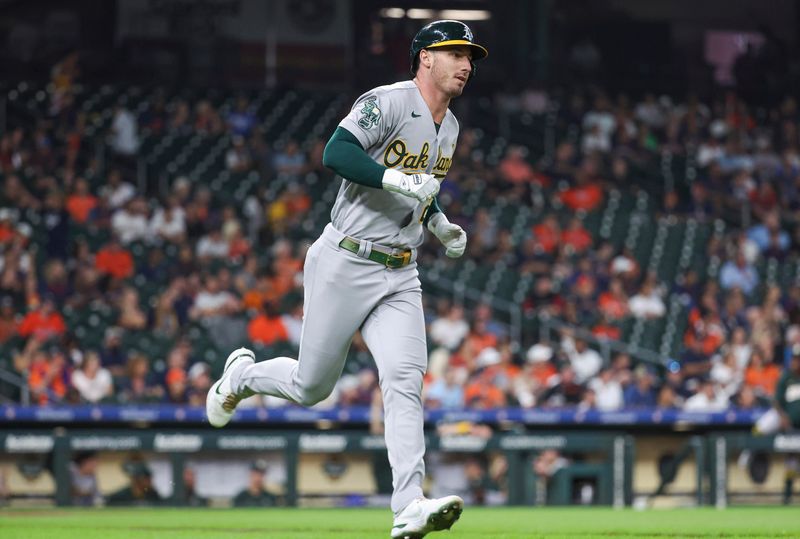 Sep 11, 2023; Houston, Texas, USA; Oakland Athletics right fielder Brent Rooker (25) hits a home run during the second inning against the Houston Astros at Minute Maid Park. Mandatory Credit: Troy Taormina-USA TODAY Sports