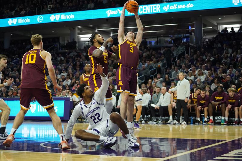 Jan 3, 2026; Evanston, Illinois, USA; Minnesota Golden Gophers forward Bobby Durkin (3) grabs the ball over Northwestern Wildcats forward Arrinten Page (22) during the first half at Welsh-Ryan Arena. Mandatory Credit: David Banks-Imagn Images