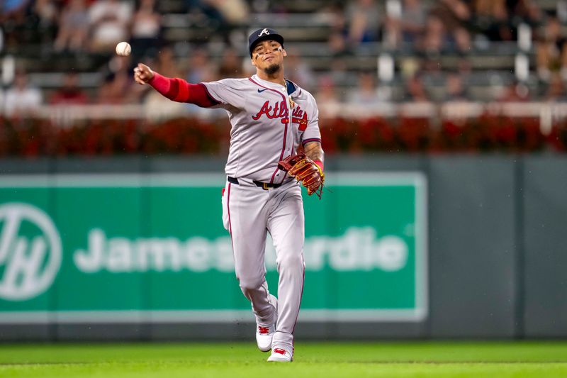 Aug 26, 2024; Minneapolis, Minnesota, USA; Atlanta Braves shortstop Orlando Arcia (11) throws the ball to first base for an out agains the Minnesota Twins in the third inning at Target Field. Mandatory Credit: Jesse Johnson-USA TODAY Sports