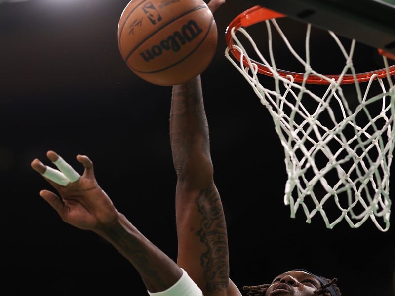 BOSTON, MASSACHUSETTS - FEBRUARY 03: Robert Williams III #44 of the Boston Celtics grabs a rebound over Deandre Ayton #22 of the Phoenix Suns  at TD Garden on February 03, 2023 in Boston, Massachusetts. NOTE TO USER: User expressly acknowledges and agrees that, by downloading and or using this photograph, User is consenting to the terms and conditions of the Getty Images License Agreement. (Photo by Maddie Meyer/Getty Images)