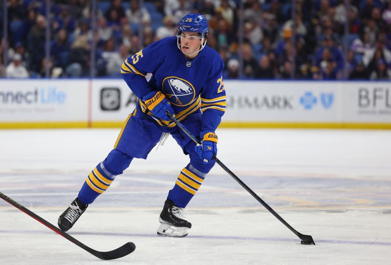 Nov 9, 2024; Buffalo, New York, USA;  Buffalo Sabres defenseman Owen Power (25) looks to make a pass during the second period against the Calgary Flames at KeyBank Center. Mandatory Credit: Timothy T. Ludwig-Imagn Images