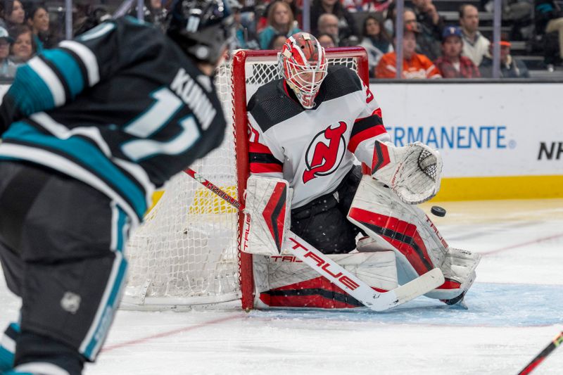 Feb 27, 2024; San Jose, California, USA;  San Jose Sharks center Thomas Bordeleau (17) shot is just wide of New Jersey Devils goaltender Nico Daws (50) during the second period at SAP Center at San Jose. Mandatory Credit: Neville E. Guard-USA TODAY Sports