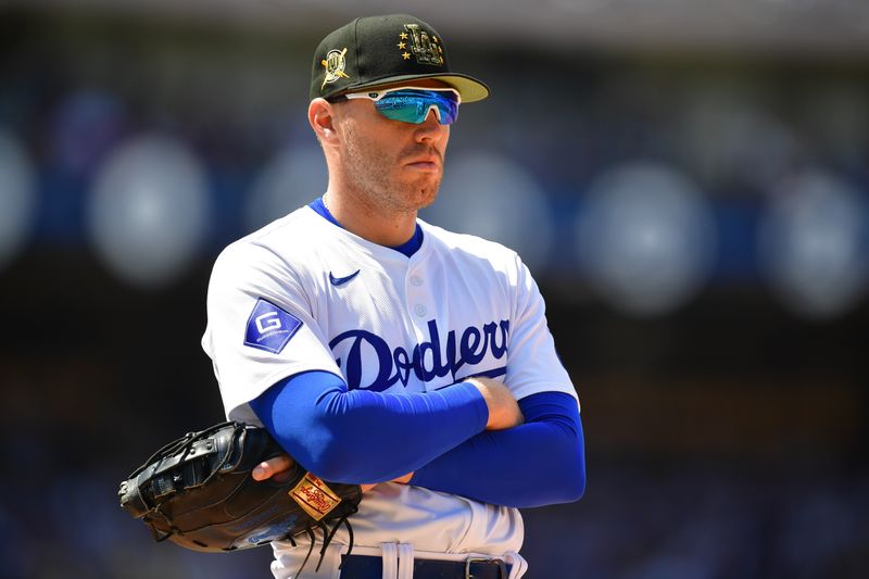 May 19, 2024; Los Angeles, California, USA; Los Angeles Dodgers first baseman Freddie Freeman (5) during a stoppage in play in the sixth inning at Dodger Stadium. Mandatory Credit: Gary A. Vasquez-USA TODAY Sports