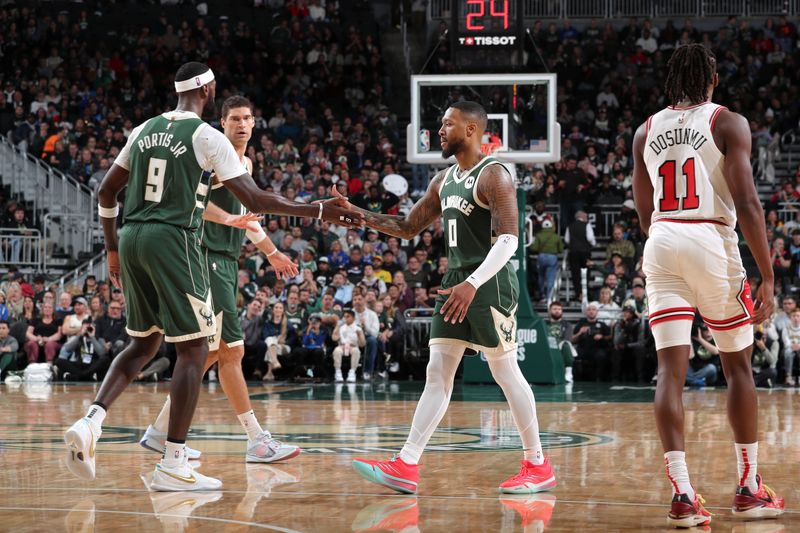 MILWAUKEE, WI - NOVEMBER 20: Damian Lillard #0 and Bobby Portis #9 of the Milwaukee Bucks high five during the game against the Chicago Bulls on November 20, 2024 at the Fiserv Forum Center in Milwaukee, Wisconsin. NOTE TO USER: User expressly acknowledges and agrees that, by downloading and or using this Photograph, user is consenting to the terms and conditions of the Getty Images License Agreement. Mandatory Copyright Notice: Copyright 2024 NBAE (Photo by Gary Dineen/NBAE via Getty Images).