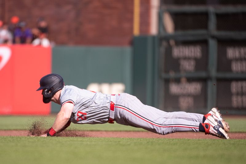 Jul 13, 2024; San Francisco, California, USA; Minnesota Twins catcher Ryan Jeffers (27) slides into second base during the fourth inning of the game against the San Francisco Giants at Oracle Park. Mandatory Credit: Ed Szczepanski-USA TODAY Sports