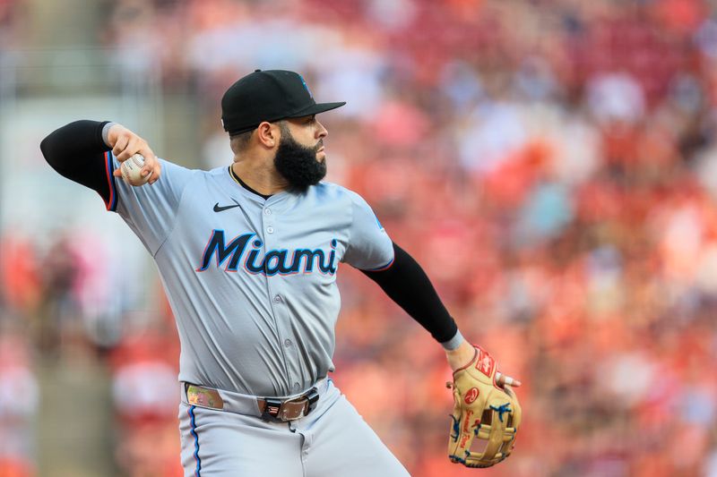 Jul 12, 2024; Cincinnati, Ohio, USA; Miami Marlins third baseman Emmanuel Rivera (15) throws to first to get Cincinnati Reds catcher Tyler Stephenson (not pictured) out in the first inning at Great American Ball Park. Mandatory Credit: Katie Stratman-USA TODAY Sports