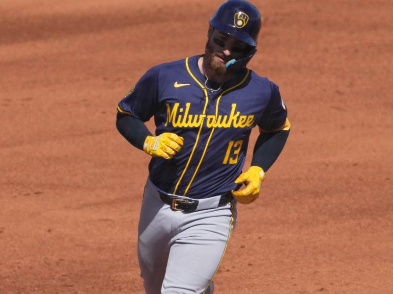 Mar 14, 2024; Peoria, Arizona, USA; Milwaukee Brewers catcher Eric Haase (13) runs the bases after hitting a solo home run against the Seattle Mariners during the fifth inning at Peoria Sports Complex. Mandatory Credit: Joe Camporeale-USA TODAY Sports