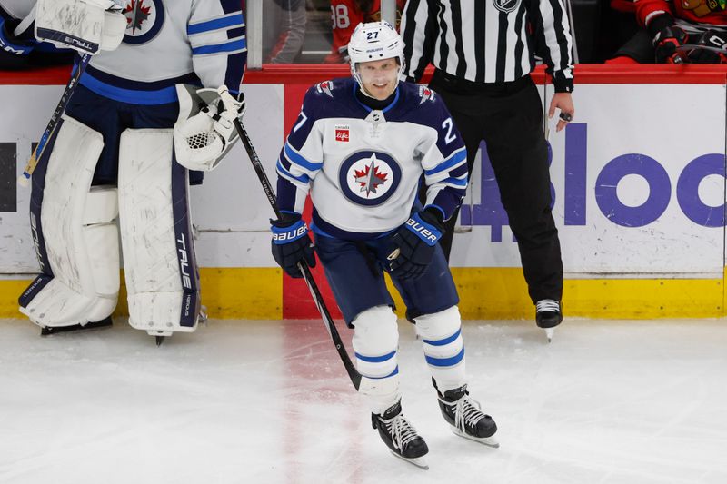 Feb 23, 2024; Chicago, Illinois, USA; Winnipeg Jets left wing Nikolaj Ehlers (27) smiles after scoring against the Chicago Blackhawks during the second period at United Center. Mandatory Credit: Kamil Krzaczynski-USA TODAY Sports