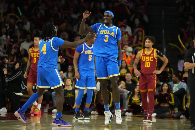 Jan 27, 2024; Los Angeles, California, USA; UCLA Bruins forward Adem Bona (3) celebrates with guard Will McClendon (4) against the Southern California Trojans in the second half at Galen Center. Mandatory Credit: Kirby Lee-USA TODAY Sports