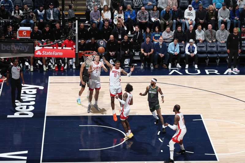 MINNEAPOLIS, MN -  APRIL 2: Jabari Smith Jr. #10 of the Houston Rockets grabs a rebound during the game against the Minnesota Timberwolves  on April 2, 2024 at Target Center in Minneapolis, Minnesota. NOTE TO USER: User expressly acknowledges and agrees that, by downloading and or using this Photograph, user is consenting to the terms and conditions of the Getty Images License Agreement. Mandatory Copyright Notice: Copyright 2024 NBAE (Photo by David Sherman/NBAE via Getty Images)