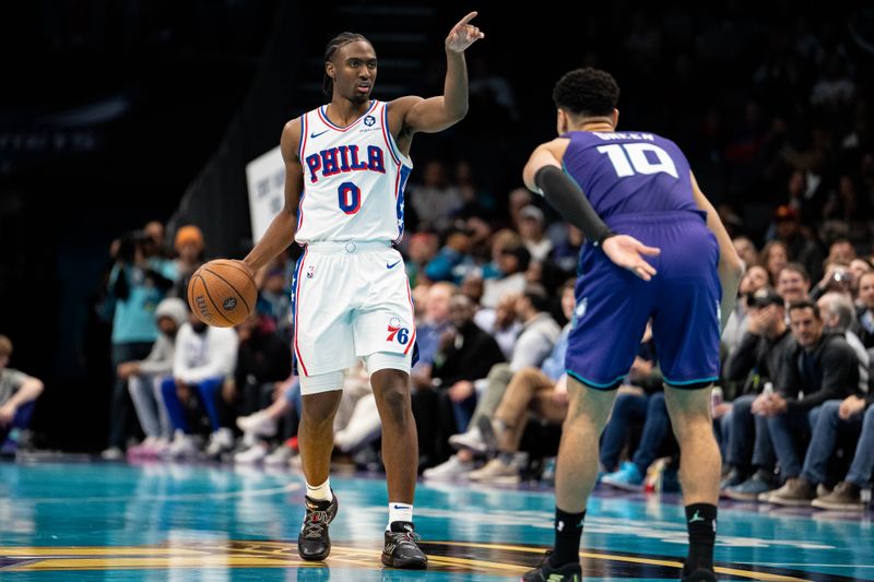 CHARLOTTE, NORTH CAROLINA - DECEMBER 03: Josh Green #10 of the Charlotte Hornets guards Tyrese Maxey #0 of the Philadelphia 76ers in the fourth quarter of the game during the Emirates NBA Cup at Spectrum Center on December 03, 2024 in Charlotte, North Carolina. NOTE TO USER: User expressly acknowledges and agrees that, by downloading and or using this photograph, User is consenting to the terms and conditions of the Getty Images License Agreement. (Photo by Jacob Kupferman/Getty Images)