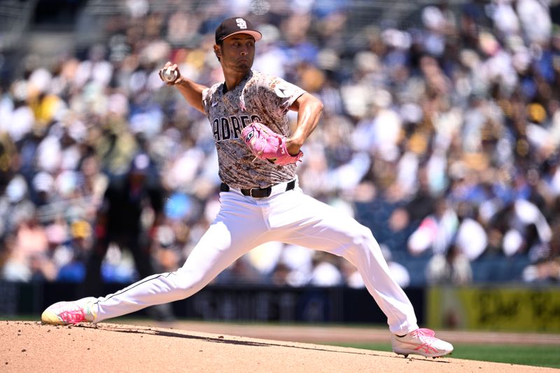 May 12, 2024; San Diego, California, USA; San Diego Padres starting pitcher Yu Darvish (11) throws a pitch against the Los Angeles Dodgers during the first inning at Petco Park. Mandatory Credit: Orlando Ramirez-USA TODAY Sports