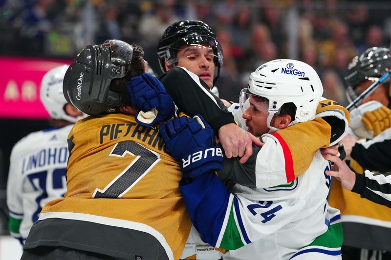 Mar 7, 2024; Las Vegas, Nevada, USA; Vegas Golden Knights defenseman Alex Pietrangelo (7) skuffles with Vancouver Canucks center Pius Suter (24) during the first period at T-Mobile Arena. Mandatory Credit: Stephen R. Sylvanie-USA TODAY Sports