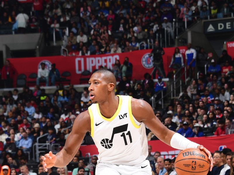 LOS ANGELES, CA - APRIL 5:  Kris Dunn #11 of the Utah Jazz handles the ball during the game  on April 5, 2024 at Crypto.Com Arena in Los Angeles, California. NOTE TO USER: User expressly acknowledges and agrees that, by downloading and/or using this Photograph, user is consenting to the terms and conditions of the Getty Images License Agreement. Mandatory Copyright Notice: Copyright 2024 NBAE (Photo by Adam Pantozzi/NBAE via Getty Images)
