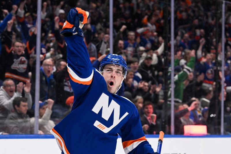 Mar 5, 2024; Elmont, New York, USA;  New York Islanders center Jean-Gabriel Pageau (44) celebrates a goal during the second period against the St. Louis Blues at UBS Arena. Mandatory Credit: Dennis Schneidler-USA TODAY Sports