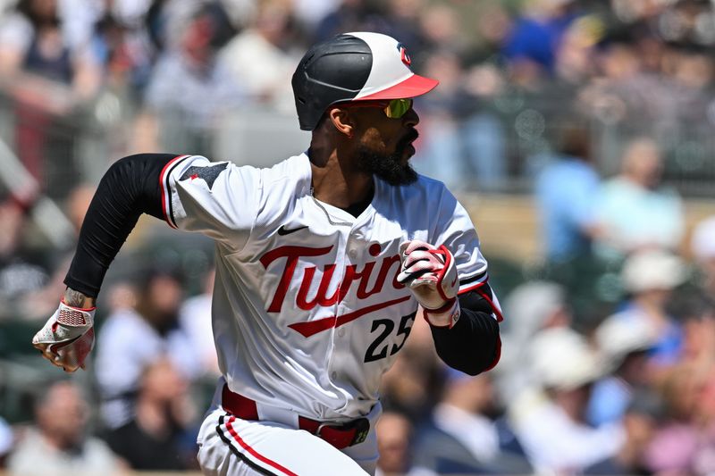 Apr 26, 2025; Minneapolis, Minnesota, USA; Minnesota Twins outfielder Byron Buxton (25) runs to first base after a single during the first inning off Los Angeles Angels pitcher Yusei Kikuchi (not pictured) at Target Field. Mandatory Credit: Jeffrey Becker-Imagn Images