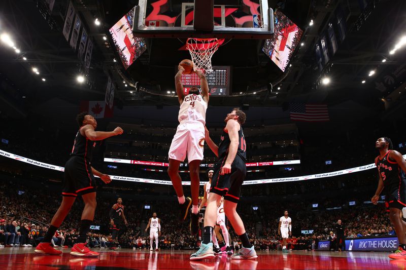 TORONTO, CANADA - FEBRUARY 10: Evan Mobley #4 of the Cleveland Cavaliers drives to the basket during the game against the Toronto Raptors on February 10, 2024 at the Scotiabank Arena in Toronto, Ontario, Canada.  NOTE TO USER: User expressly acknowledges and agrees that, by downloading and or using this Photograph, user is consenting to the terms and conditions of the Getty Images License Agreement.  Mandatory Copyright Notice: Copyright 2024 NBAE (Photo by Vaughn Ridley/NBAE via Getty Images)