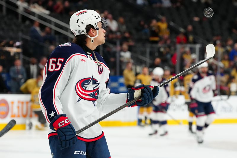 Jan 30, 2025; Las Vegas, Nevada, USA; Columbus Blue Jackets center Luca Del Bel Belluz (65) warms up before a game against the Vegas Golden Knights at T-Mobile Arena. Mandatory Credit: Stephen R. Sylvanie-Imagn Images