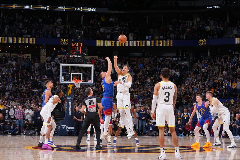 DENVER, CO - NOVEMBER 2: Utah Jazz and Denver Nuggets go up for a jump ball during a regular season game on November 22, 2024 at Ball Arena in Denver, Colorado. NOTE TO USER: User expressly acknowledges and agrees that, by downloading and/or using this Photograph, user is consenting to the terms and conditions of the Getty Images License Agreement. Mandatory Copyright Notice: Copyright 2024 NBAE (Photo by Bart Young/NBAE via Getty Images)