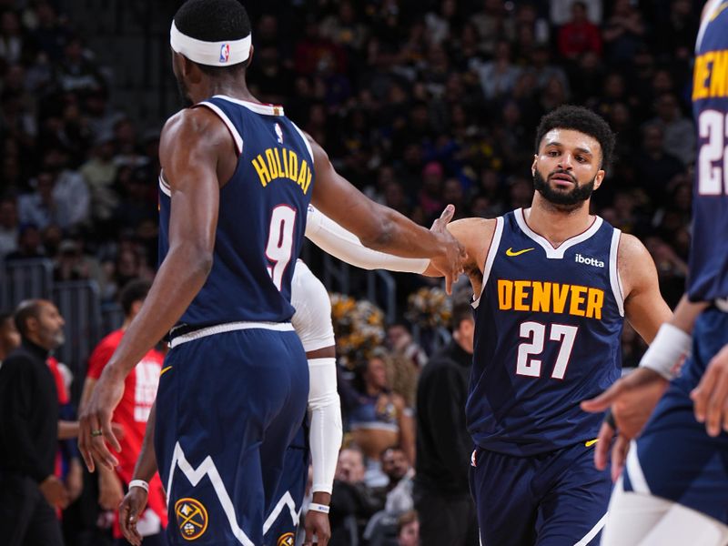 DENVER, CO - FEBRUARY 22: Justin Holiday #9 and Jamal Murray #27 of the Denver Nuggets high five during the game against the Washington Wizards on February 22, 2024 at the Ball Arena in Denver, Colorado. NOTE TO USER: User expressly acknowledges and agrees that, by downloading and/or using this Photograph, user is consenting to the terms and conditions of the Getty Images License Agreement. Mandatory Copyright Notice: Copyright 2024 NBAE (Photo by Garrett Ellwood/NBAE via Getty Images)