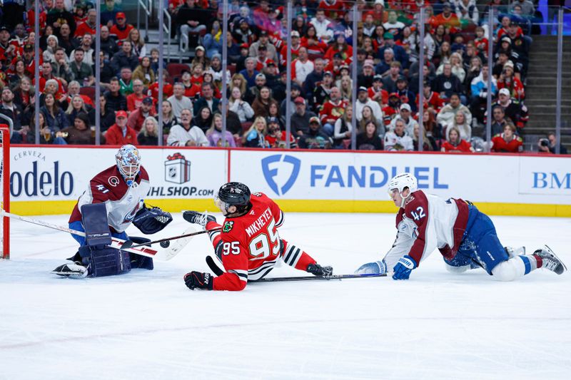 Nov 23, 2025; Chicago, Illinois, USA; Colorado Avalanche defenseman Josh Manson (42) fouls Chicago Blackhawks right wing Ilya Mikheyev (95) during the first period at United Center. Mandatory Credit: Kamil Krzaczynski-Imagn Images
