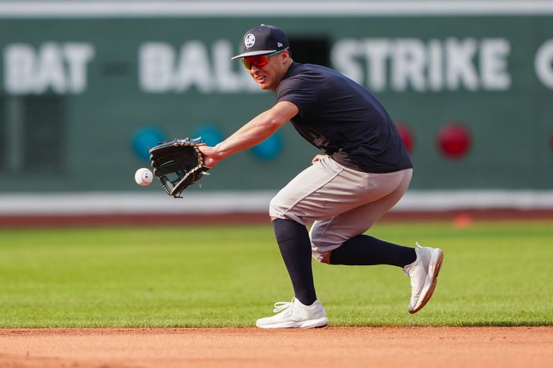 Jul 27, 2024; Boston, Massachusetts, USA; New York Yankees shortstop Anthony Volpe (11) takes infield practice prior to the game against the Boston Red Sox at Fenway Park. Mandatory Credit: Gregory Fisher-USA TODAY Sports