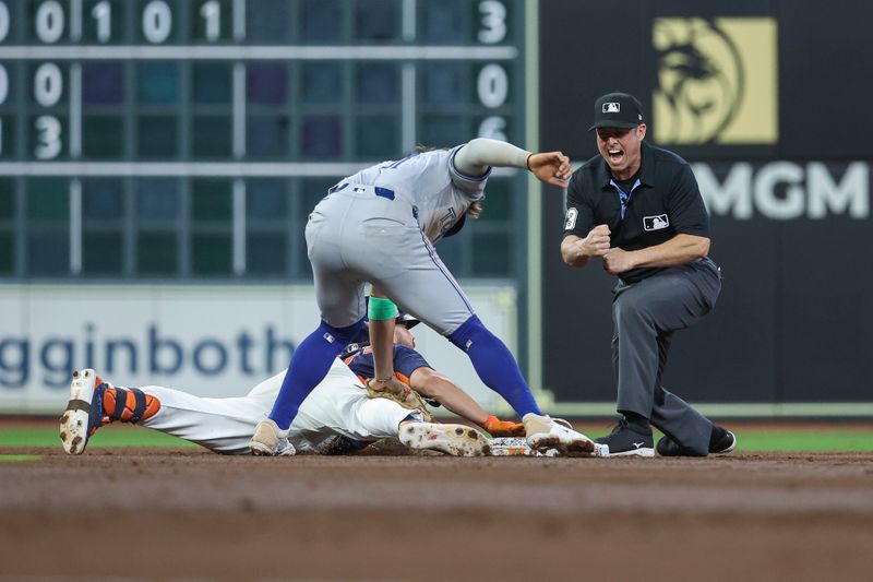 Apr 2, 2024; Houston, Texas, USA; Houston Astros center fielder Chas McCormick (20) is called out by the umpire as Toronto Blue Jays shortstop Bo Bichette (11) applies a a tag on a play during the third inning at Minute Maid Park. Mandatory Credit: Troy Taormina-USA TODAY Sports