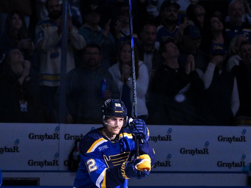 Nov 3, 2025; St. Louis, Missouri, USA; St. Louis Blues center Pius Suter (22) salutes the fans after he was named second star of the game in a victory over the Edmonton Oilers at Enterprise Center. Mandatory Credit: Jeff Curry-Imagn Images