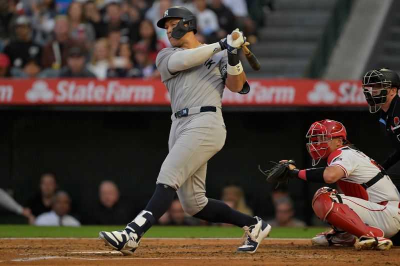 May 26, 2025; Anaheim, California, USA;  New York Yankees right fielder Aaron Judge (99) singles in the fourth inning against the Los Angeles Angels at Angel Stadium. Mandatory Credit: Jayne Kamin-Oncea-Imagn Images