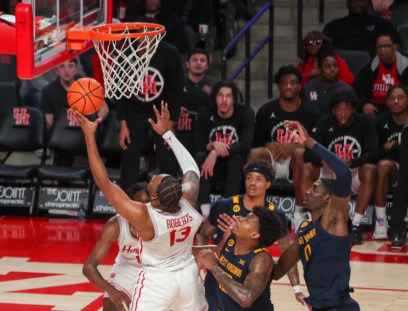 Jan 15, 2025; Houston, Texas, USA; Houston Cougars forward J'Wan Roberts (13) scores against the West Virginia Mountaineers in the second half at Fertitta Center. Mandatory Credit: Thomas Shea-Imagn Images