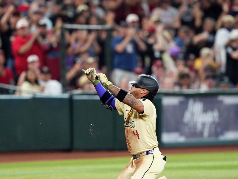 May 18, 2024; Phoenix, Arizona, USA; Arizona Diamondbacks second base Ketel Marte (4) celebrates after hitting an RBI triple against the Detroit Tigers during the sixth inning at Chase Field. Mandatory Credit: Joe Camporeale-USA TODAY Sports