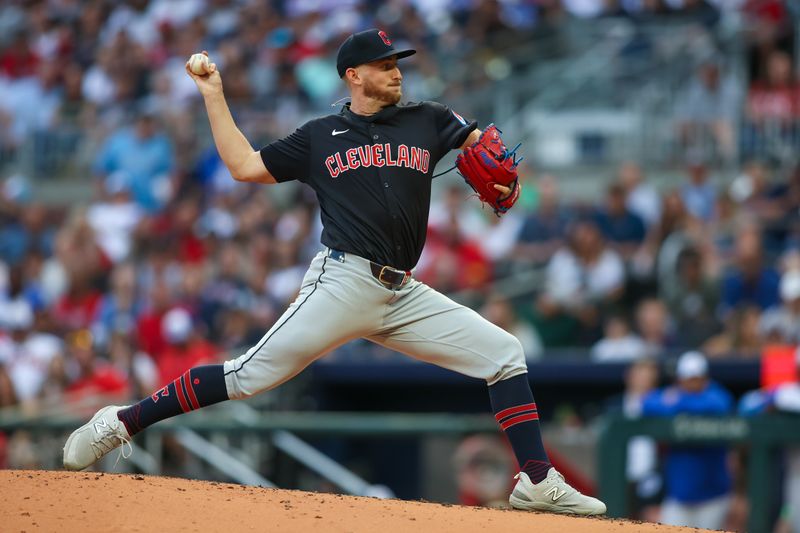 Apr 27, 2024; Atlanta, Georgia, USA; Cleveland Guardians starting pitcher Tanner Bibee (28) throws against the Atlanta Braves in the second inning at Truist Park. Mandatory Credit: Brett Davis-USA TODAY Sports