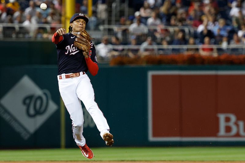 Sep 21, 2023; Washington, District of Columbia, USA; Washington Nationals shortstop CJ Abrams (5) makes a throw to first base on a ground ball hit by Atlanta Braves left fielder Eddie Rosario (not pictured) during the third inning at Nationals Park. Mandatory Credit: Geoff Burke-USA TODAY Sports