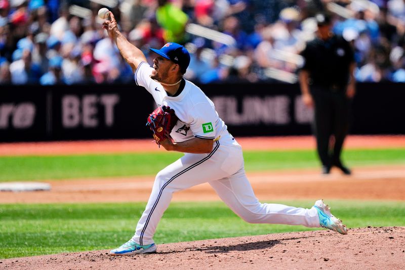 Jul 28, 2024; Toronto, Ontario, CAN; Toronto Blue Jays starting pitcher José Berríos (17) pitches to the Texas Rangers during the third inning at Rogers Centre. Mandatory Credit: John E. Sokolowski-USA TODAY Sports